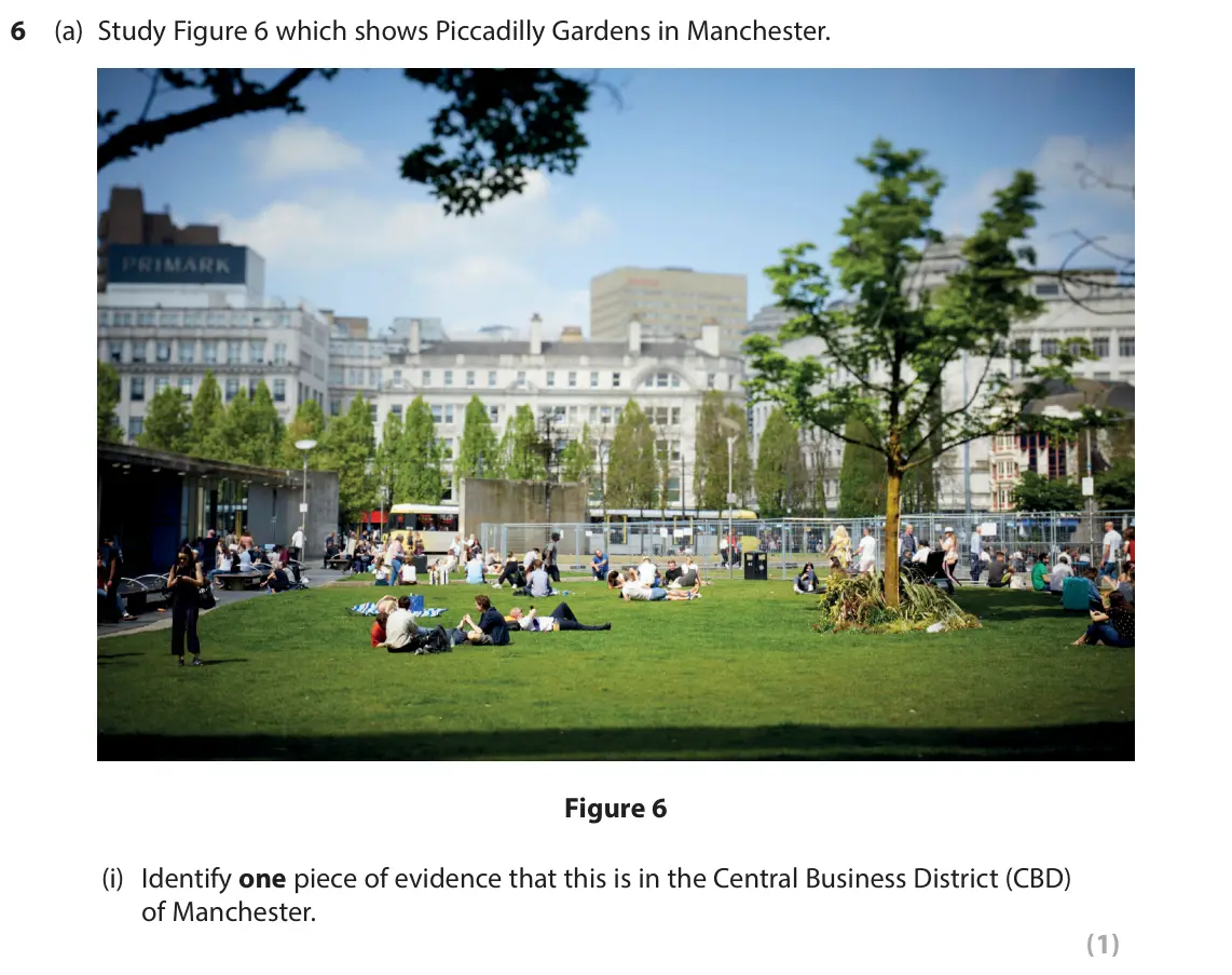 June 2025 Paper 2, question 6(a)(i): Identify one piece of evidence that this is in the Central Business District (CBD) of Manchester. (1)